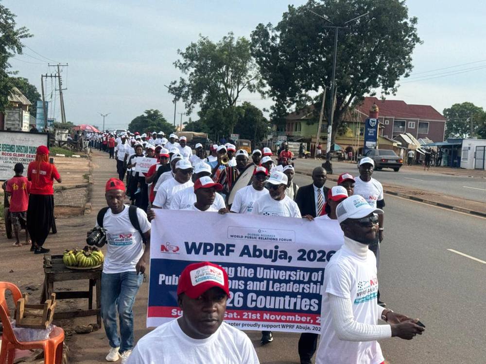 Walkers behind the Gudi banner